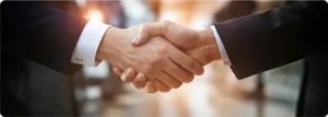 Business professionals shaking hands in a partnership meeting